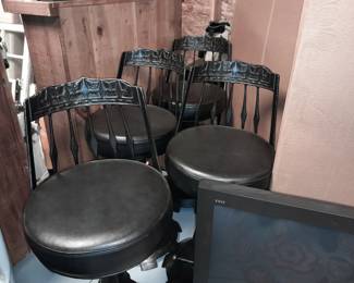 Cast iron backs and very nice cushioned seats on these bar stools