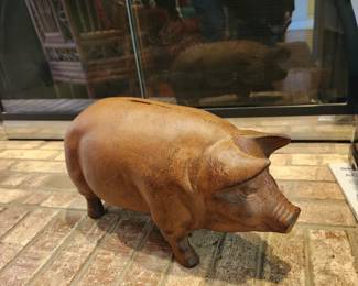 large, heavy metal piggy bank