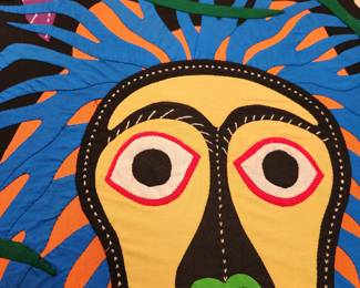 large, hand-stitched fabric wall art