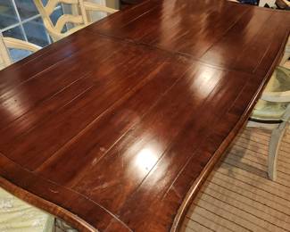 distressed wood painted base dining table with 6 matching chairs w/ cushions.  The chairs are sold with the table