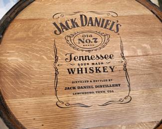 Jack Daniels whiskey barrel pub table, with heavy wooden topauthentic Jack Daniels whiskey barrel table with metal footrail & glass top center