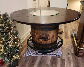 authentic Jack Daniels whiskey barrel table with metal footrail & glass top center
