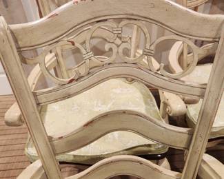 distressed wood painted base dining table with 6 matching chairs w/ cushions.  The chairs are sold with the table