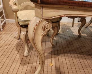 distressed wood painted base dining table with 6 matching chairs w/ cushions.  The chairs are sold with the table