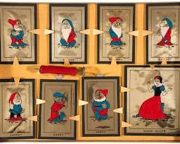 The Snow White "Tap-A-Way Metal Art" set was produced by the Naylor Corporation, circa 1938. 