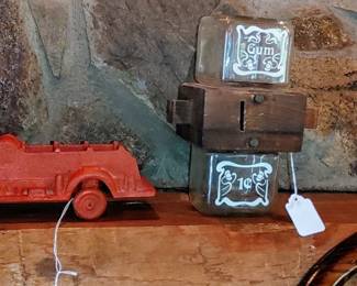 Cast iron vintage fire truck and 1 cent gumball machine