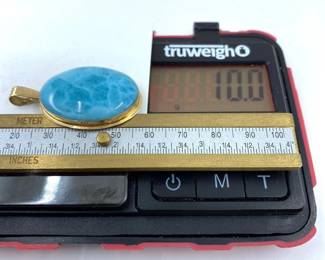 This 14K solid yellow gold pendant with a natural larimar gemstone is on sale for $400. The size and weight in grams is shown on the picture. Please call or text 703-895-9344 to buy or for questions.
