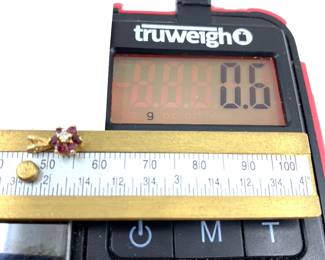 This 14K solid yellow gold pendant with natural diamonds and ruby gemstones is on sale for $36. The size and weight in grams is shown on the picture. Please call or text 703-895-9344 to buy or for questions.