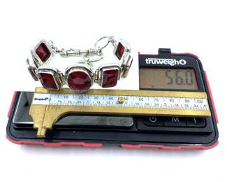 This solid sterling silver bracelet with natural ruby gemstones is on sale for $400. The size and weight in grams is shown on the picture. Please call or text 703-895-9344 to buy or for questions.