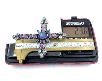 This solid sterling silver cross pendant with mixed gemstones is on sale for $400. The size and weight in grams is shown on the picture. Please call or text 703-895-9344 to buy or for questions.