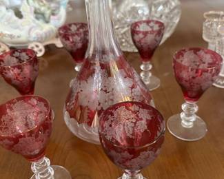 Red glass decanter and goblets