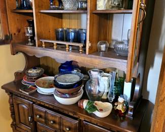 Blue glassware and nice hutch and buffet.