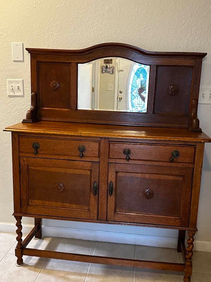 Antique Jacobean period early 1900’s buffet with mirror and barely twist legs. Two drawers and two cabinet doors