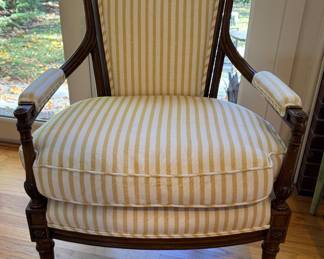 Pair of French Provincial Fireside Arm Chairs with Hand-Carved Acorn Finials. Chairs Are Upholstered in Yellow & White Stripe Cotton Fabric with Coordinating Trim. Each Measures 25" W with 9" Seat Depth. Photo 1 of 5.