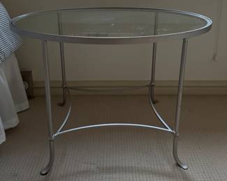 Oval Glass-Top Iron Side Table In Silver Finish. Measures 36" x 24" x 24" H. Photo 1 of 3.