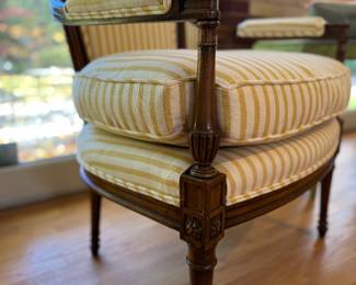 Pair of French Provincial Fireside Arm Chairs with Hand-Carved Acorn Finials. Chairs Are Upholstered in Yellow & White Stripe Cotton Fabric with Coordinating Trim. Each Measures 25" W with 9" Seat Depth. Photo 4 of 5.