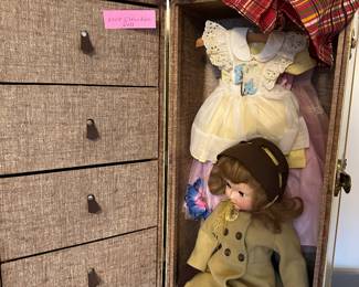 This is a beautiful hadn't carved hall table! On top is a 1955 Effenbee Doll, Her Clothing Chest and ALL accessories! 