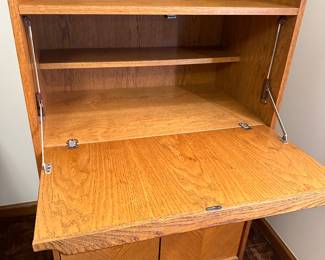 A very nice MCM Secretary! Opens to desk, and has cupboards on the bottom! 