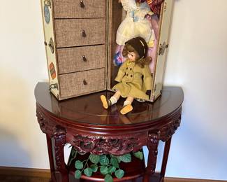 This is a beautiful hadn't carved hall table! On top is a 1955 Effenbee Doll, Her Clothing Chest and ALL accessories! 