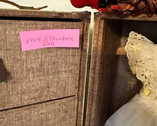 This is a beautiful hadn't carved hall table! On top is a 1955 Effenbee Doll, Her Clothing Chest and ALL accessories! 