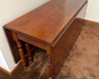 This is a beautiful antique double sided drop leaf table. In excellent vintage condition. This is VERY large for this type of table. 