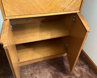 A very nice MCM Secretary! Opens to desk, and has cupboards on the bottom! 