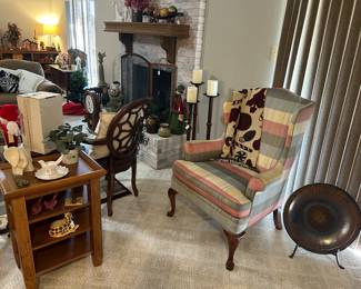 Wingback chair, heavy wrought iron candle sticks, fireplace screen, electric fireplace insert