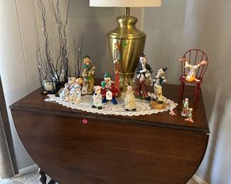 Beautiful Antique drop-leaf table, clown figurine collection, brass base lamp