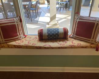 Seat cushion & pillows in window 