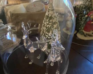 Glass deer with Christmas tree under dome 