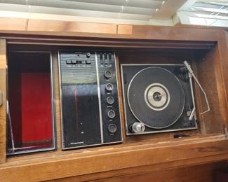 turntable, radio and vinyl holder in cabinet