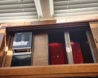 extra storage and 8 track player in cabinet