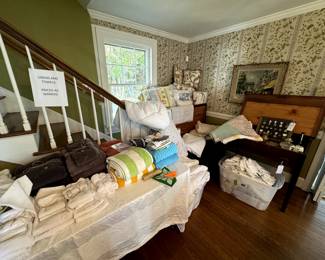 Beautiful lines, towels, comforters, blankets, also a nice nice blanket chest behind that and on the right side is an old writing desk... 1 drawer, 1800's