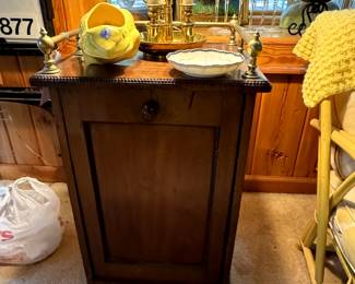 This side table was used for COAL, and the drawer pulls out, there is a shovel that slides in the back of the table... Brass fixtures on the corner. 