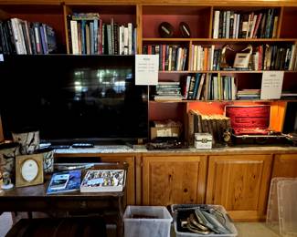 This is an older SMART TV but is excellent... and books are filling the shelves, with old records as well.. frames, 