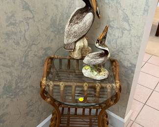 Rattan table, pelican statues