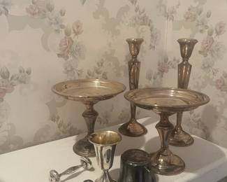 Sterling Silver candle holders, compotes, baby cup, rattle and hairbrush. 