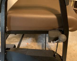 All Four legs have wheels. The back to swivel. As seen in this photo there is a handbrake that can be set for safety.
Chair makes it easier to sit and get under a table.