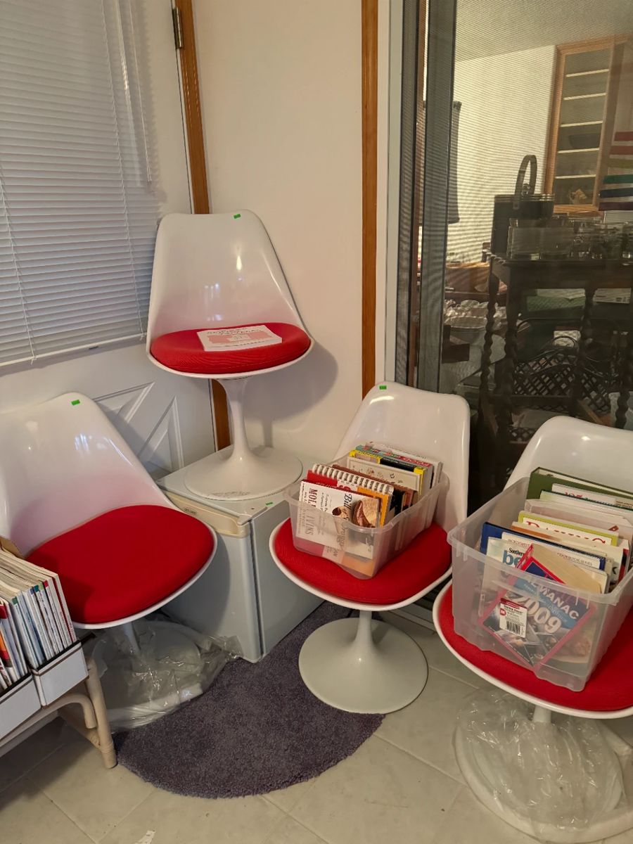 Modern repro tulip chairs. They also come with green seat covers!