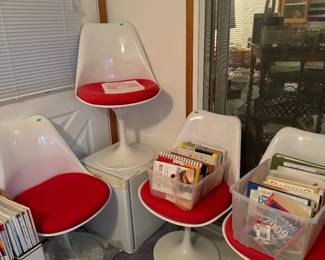 Modern repro tulip chairs. They also come with green seat covers!