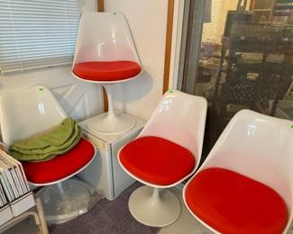Repro Tulip Chairs with red and green cushion covers