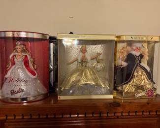 Lots or Holiday Barbies.