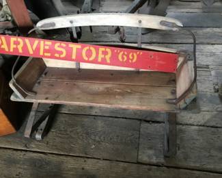 232. Harvestor sign, wagon bench