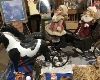 89 . Dolls in a large wagon with two horses