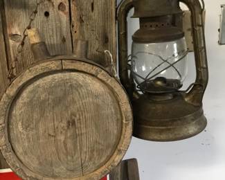 77. Lantern, wooden water container.