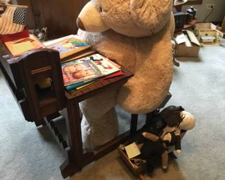 257, antique desk, large plush bear, books, dolls.