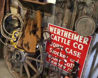75. Saddle bags, wagon wheel, sign , saddle rest, western theme.
