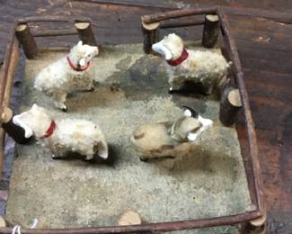 26. Miniature set of sheep in fenced pen.