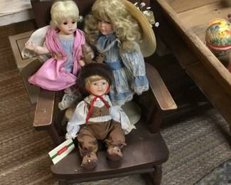 147. We have a huge collection of vintage dolls. Small furniture, chair.