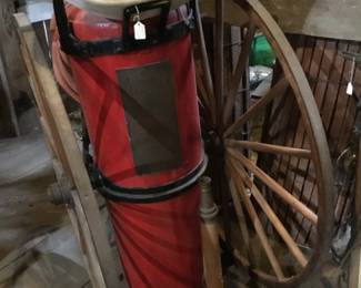 212. Antique fire hose on wheels.